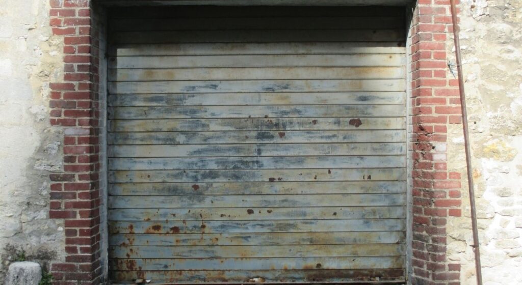 close-up of worn garage door rollers