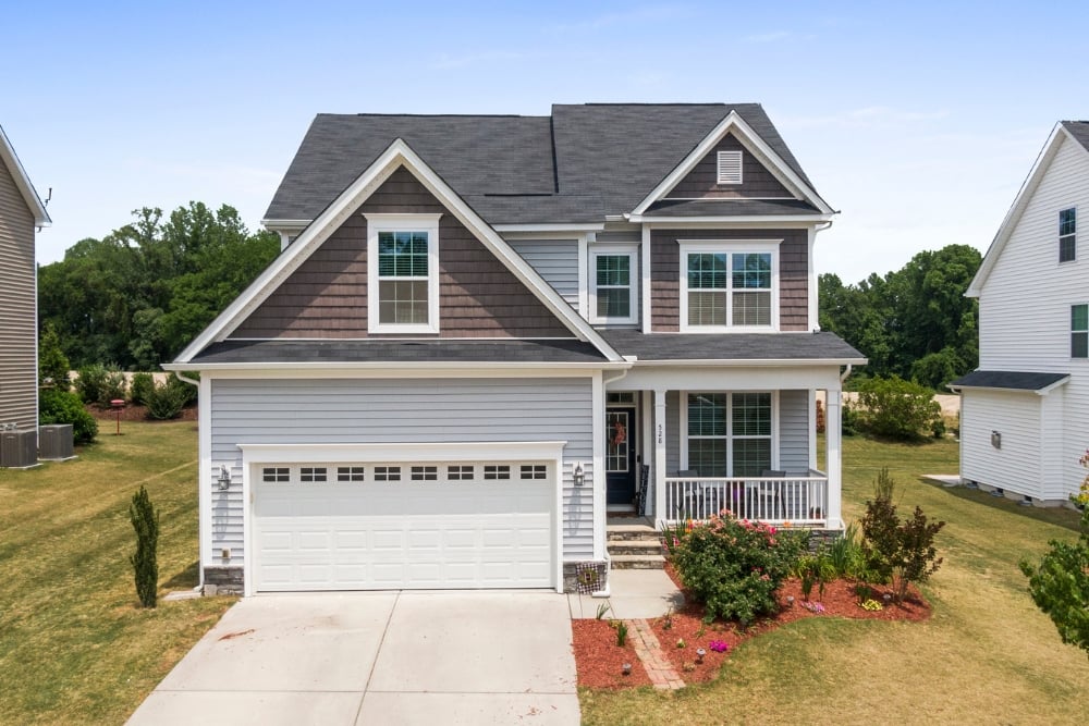 Two-storey suburban house with garage and porch