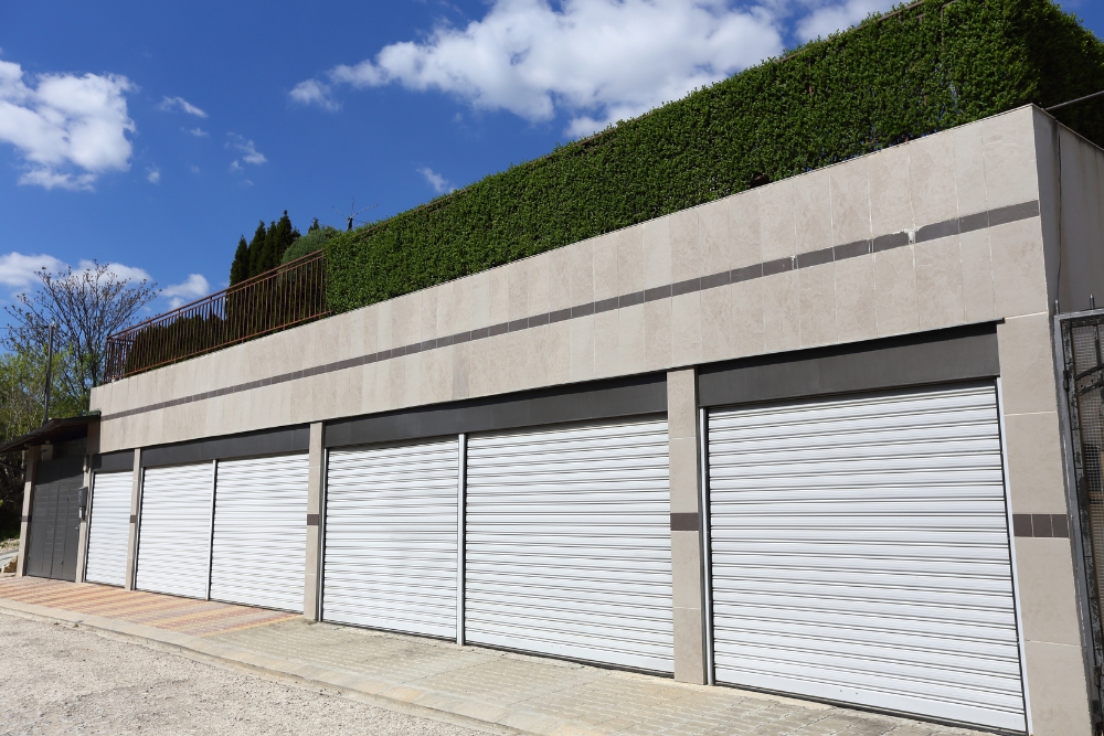 Modern building with multiple closed roller garage doors