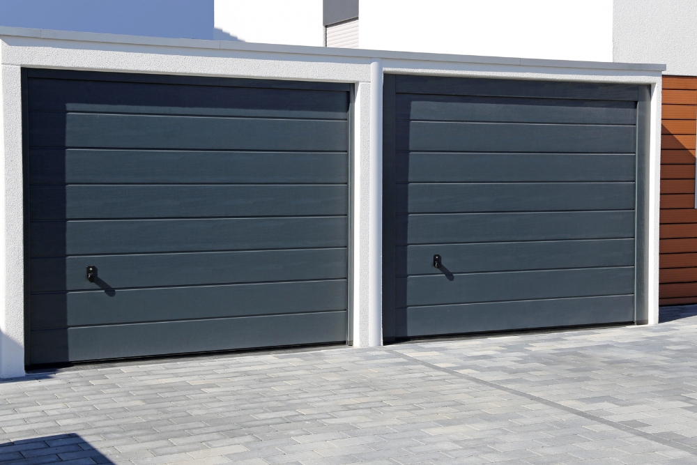 Sectional garage door in dark grey