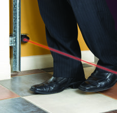 Person using a laser measure against a wall