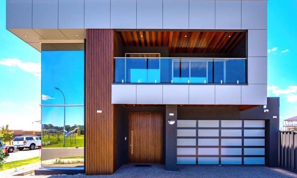 Modern two-storey home with glass balcony and garage
