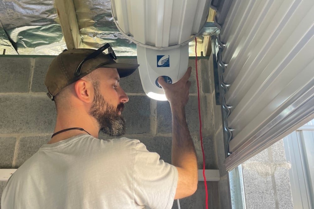 Man installing garage roller door motor