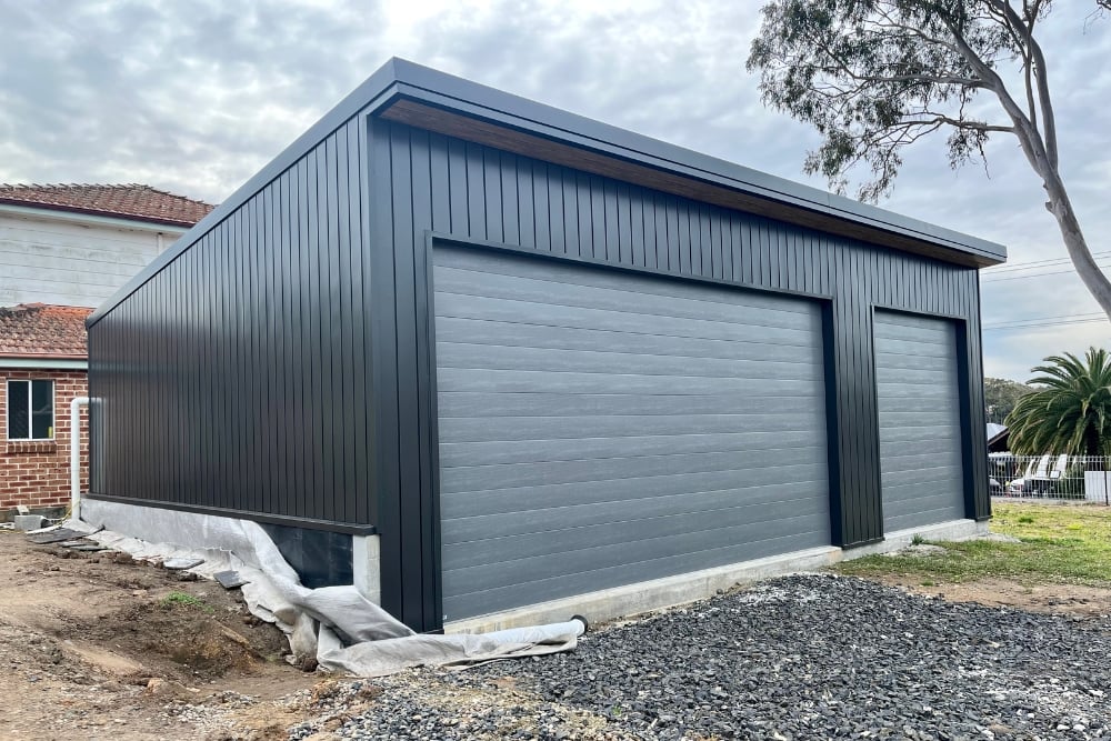 Modern double garage with two roller doors