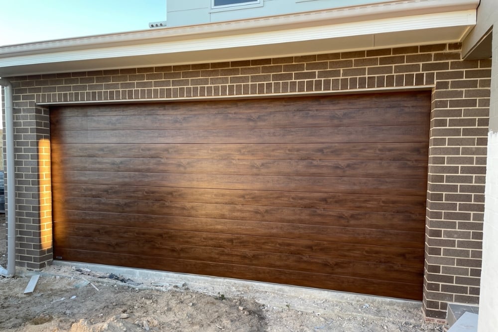 Heavy insulated double garage door with belt drive opener