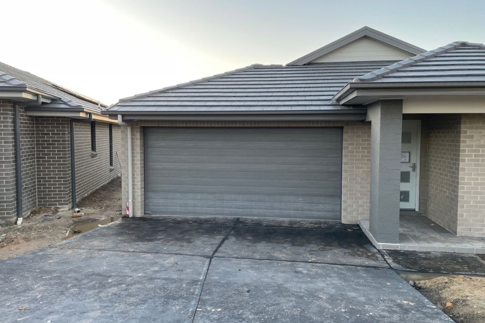 Modern brick house with double garage and driveway